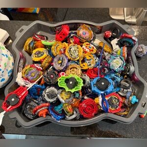 Ultimate lot of beyblades, arena included